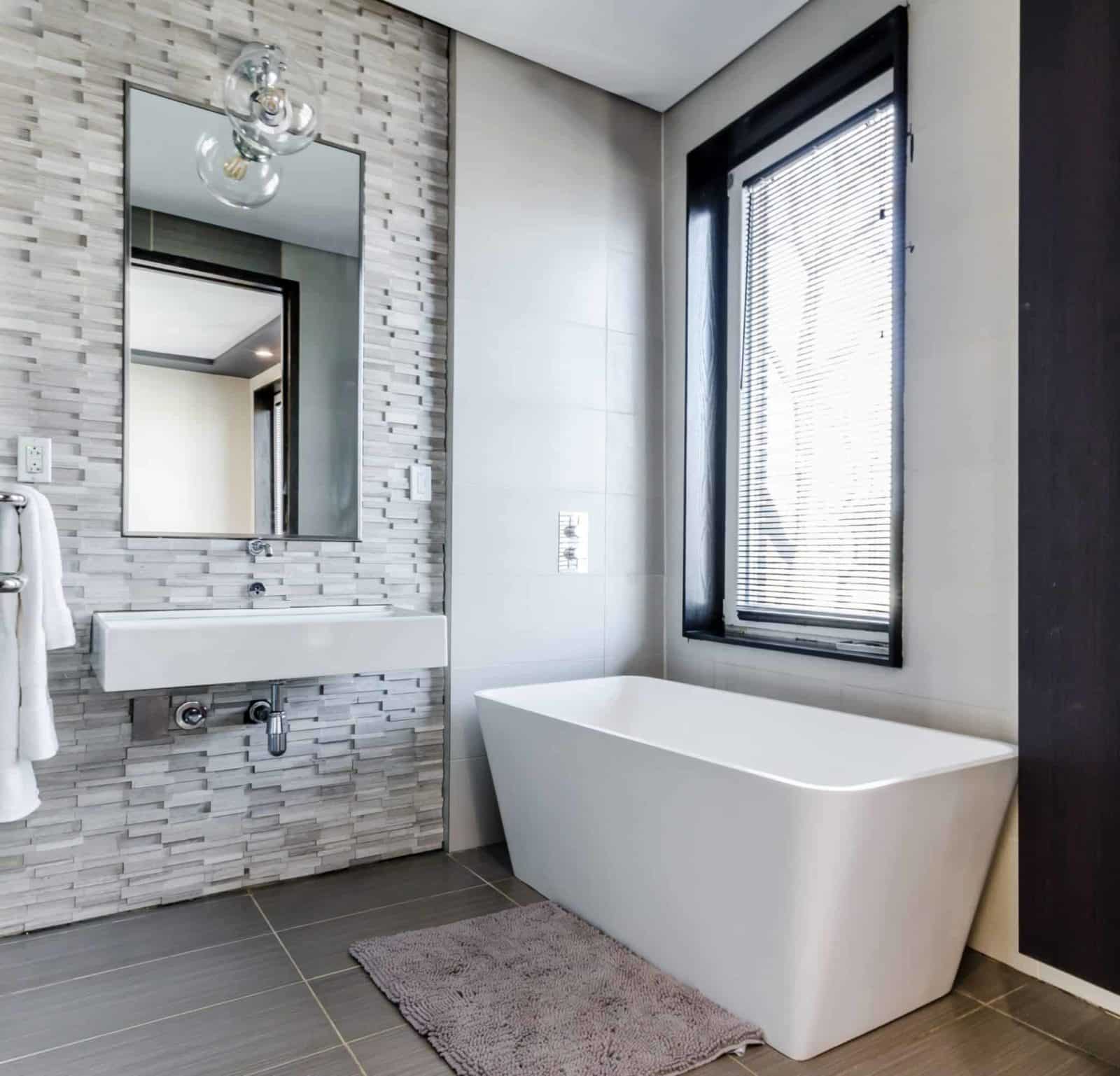 Bathroom remodel with tile accent walls