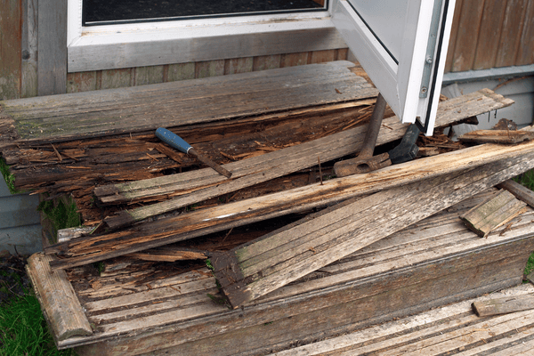 Wood rot repair around a door frame